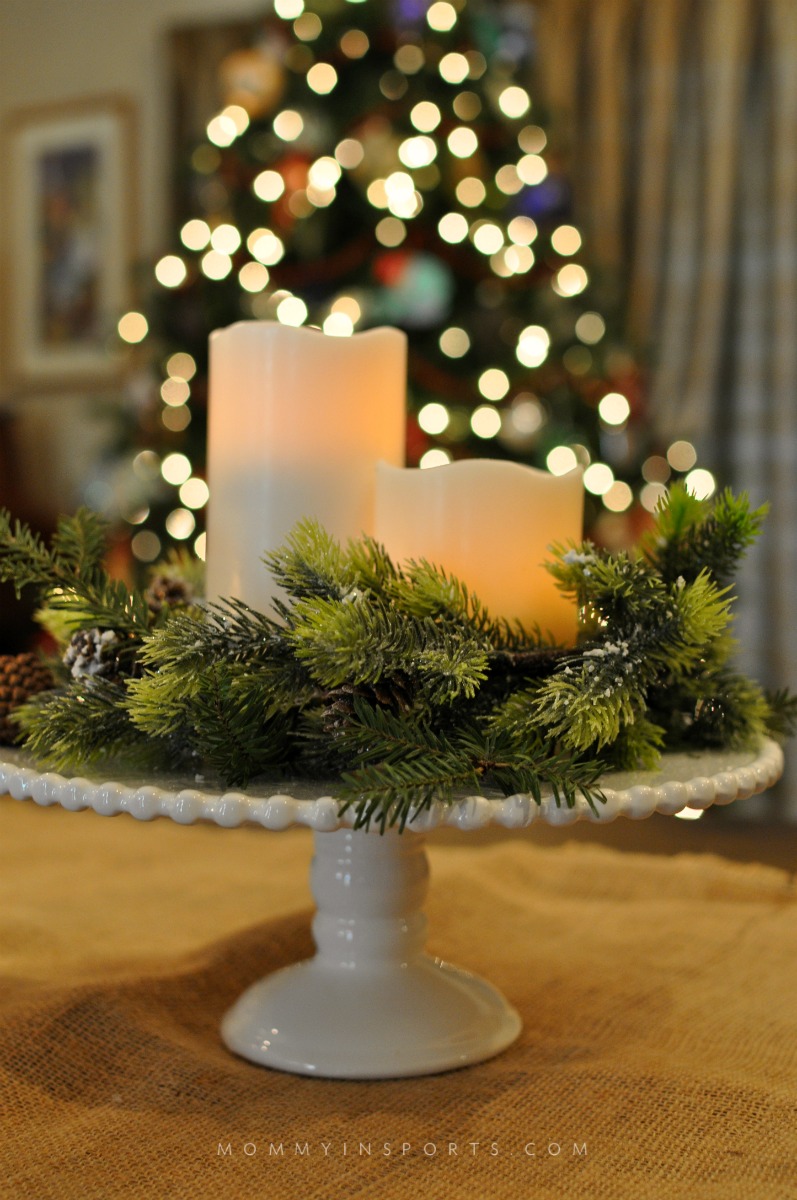 Use your cake plate to decorate! Add some greenery, pine cones and candles and you have a rustic chic DIY holiday centerpiece!
