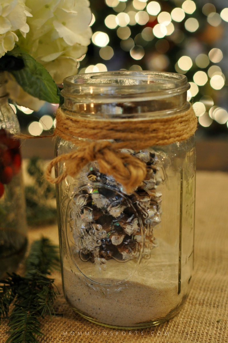 Mason Jars are perfect to use for a holiday centerpiece! Fill them with flowers, cranberries, evergreen clippings, or even pine cones for a pretty DIy holiday centerpiece!