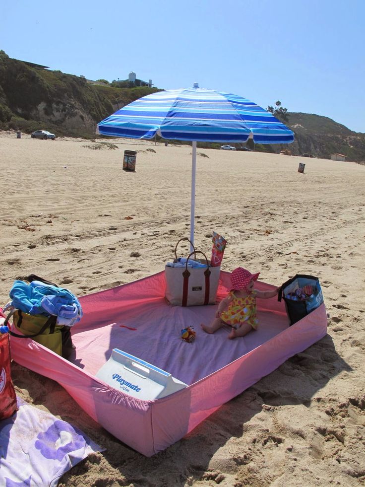 Top 5 Summer Saving Beach Hacks for Parents - use a fitted sheet to keep out sand!